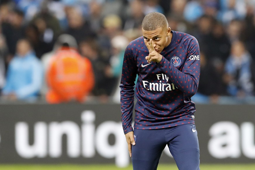 epa07127738 Kylian Mbappe of Paris Saint Germain reacts as he warms up prior to the French League 1 soccer match between the Olympique de Marseille (OM) and the Paris Saint Germain (PSG) at the Velodr ...
