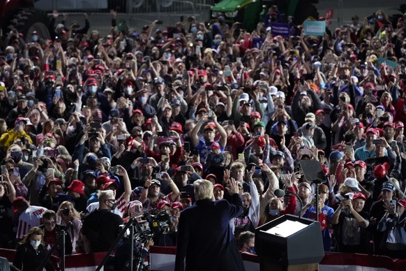 President Donald Trump waves to supporters during a campaign rally at Des Moines International Airport, Wednesday, Oct. 14, 2020, in Des Moines, Iowa. (AP Photo/Alex Brandon)
Donald Trump