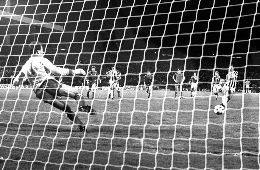 Michel Platini of Juventus, right, slots the ball past Liverpool goalkeeper Bruce Grobbelaar from the penalty spot to score the only goal in the European Cup final at the Heysel Stadium in Brussels in ...