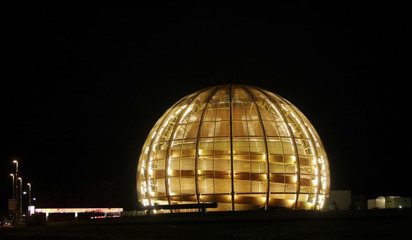 FILE - In this March 30, 2010 file picture the globe of the European Organization for Nuclear Research, CERN, is illuminated outside Geneva, Switzerland. (AP Photo/Anja Niedringhaus, file)
