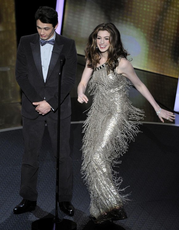Show hosts James Franco, left, and Anne Hathaway are seen during the 83rd Academy Awards on Sunday, Feb. 27, 2011, in the Hollywood section of Los Angeles. (AP Photo/Mark J. Terrill)