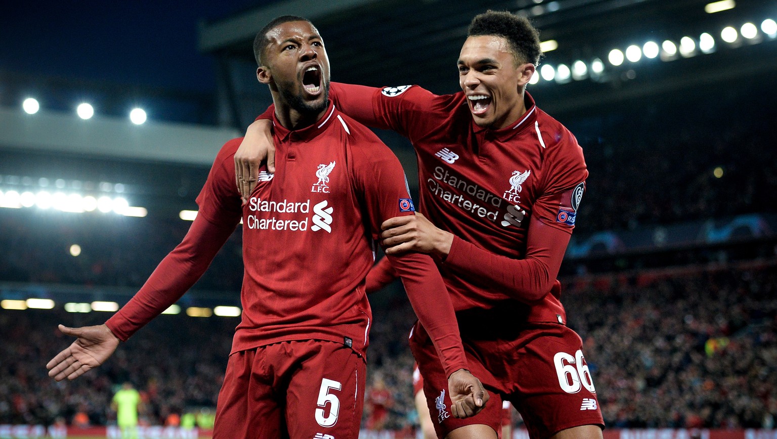 epaselect epa07554593 Liverpool&#039;s Georginio Wijnaldum (L) celebrates with his teammate Trent Alexander-Arnold (R) after scoring the 3-0 goal during the UEFA Champions League semi final second leg ...