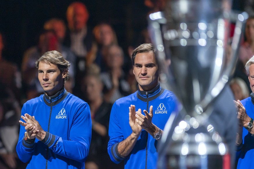Team Europe&#039;s Rafael Nadal, left, and Roger Federer, right, watch the cup during the ceremony at the Laver Cup tennis event, in Geneva, Switzerland, Friday, September 20, 2019. (KEYSTONE/Martial  ...