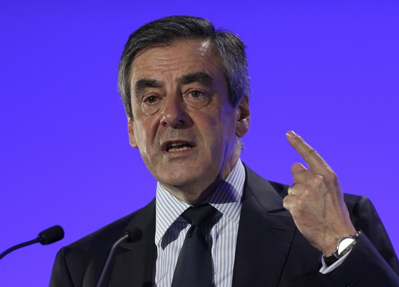 French conservative presidential candidate Francois Fillon delivers his speech during a campaign meeting in Montpellier, southern France, Friday, April, 14, 2017. The two-round presidential election i ...