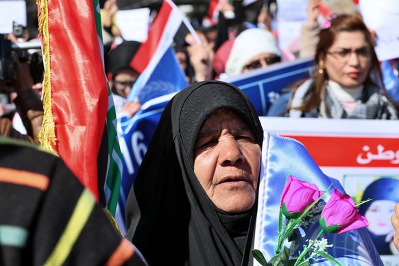 Women take part in a protest in Tahrir Square, Baghdad, Iraq, Thursday, Feb. 13, 2020. Hundreds of women took to the streets of central Baghdad and southern Iraq on Thursday in defiance of a radical c ...