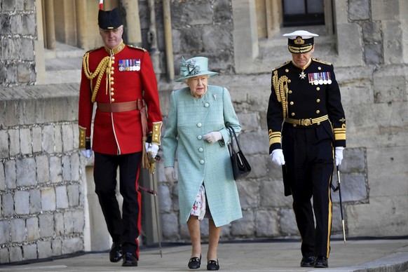 Britain&#039;s Queen Elizabeth II walks during a ceremony to mark her official birthday at Windsor Castle in Windsor, England, Saturday June 13, 2020. Queen Elizabeth II���s birthday is being marked w ...