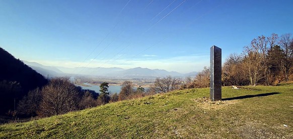 A metal structure sticks from the ground on the Batca Doamnei hill, outside Piatra Neamt, northern Romania, on Nov. 27, 2020. The structure, similar in shape and size to the monolith that was placed i ...