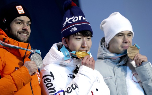 epa06514781 Gold medalist Hyojun Lim (L) of South Korea of South Korea is flanked on the podium by silver medalist Sjinkie Knegt (L) of the Netherlands and bronze winner Semen Elistratov of the Olympi ...