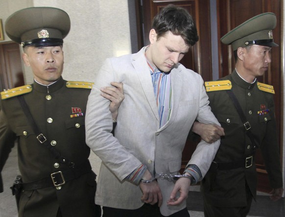 American student Otto Warmbier, center, is escorted at the Supreme Court in Pyongyang, North Korea, Wednesday, March 16, 2016. North Korea&#039;s highest court sentenced Warmbier, a 21-year-old Univer ...