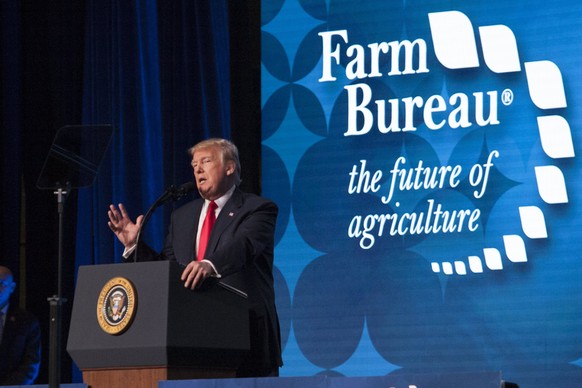 epa06425801 US President Donald J. Trump addresses a gathering of farmers and ranchers at the annual American Farm Bureau Federation convention in Nashville, Tennessee, USA, 08 January 2018. After spe ...