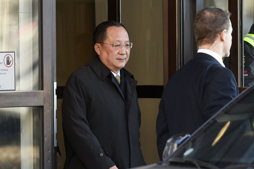 epa06607451 North Korean Foreign Minister Ri Yong Ho (C) leaves the Swedish goverment building Rosenbad in central Stockholm, Sweden, 16 March 2018. Ri Yong Ho is in Sweden to meet his Swedish counter ...