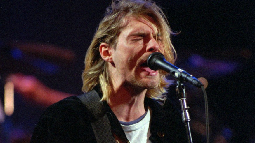 FILE - This Dec. 13, 1993 file photo shows Kurt Cobain of the Seattle band Nirvana performing in Seattle, Wash. Nirvana, which changed music and fashion in the 1990s with the punk rock-inspired grunge ...