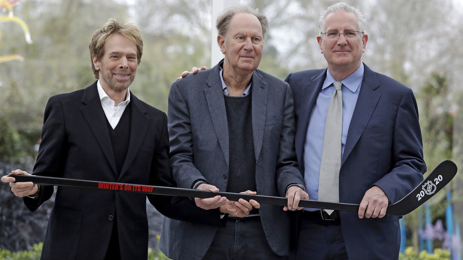 FILE - In this April 11, 2018, file photo, part-owners Jerry Bruckheimer, from left, and David Bonderman pose with Tod Leiweke and a hockey stick during a news conference naming Leiweke as the preside ...
