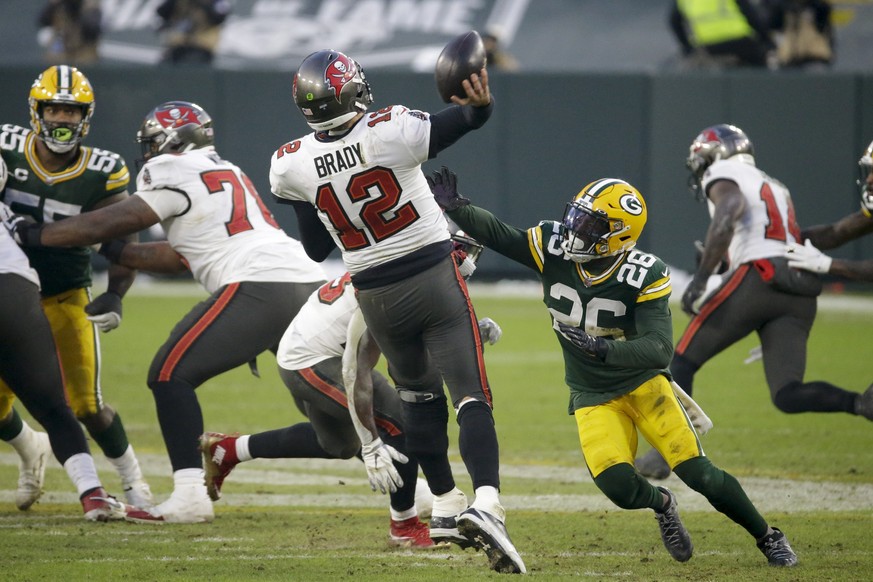 Green Bay Packers&#039; Darnell Savage (26) puts pressure on Tampa Bay Buccaneers quarterback Tom Brady as he throws a pass intercepted by Green Bay Packers&#039; Jaire Alexander during the second hal ...