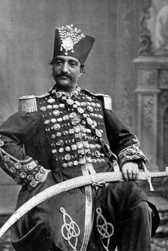 circa 1880: Nasiruddin, Shah of Persia (Iran) in regal attire, with his scimitar. (Photo by W. &amp; D. Downey/Getty Images)