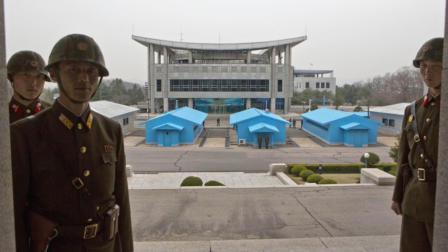 FILE - In this April 24, 2013, file photo, North Korean soldiers stand on steps overlooking the border village of Panmunjom, North Korea, which has separated the two Koreas since the Korean War. South ...