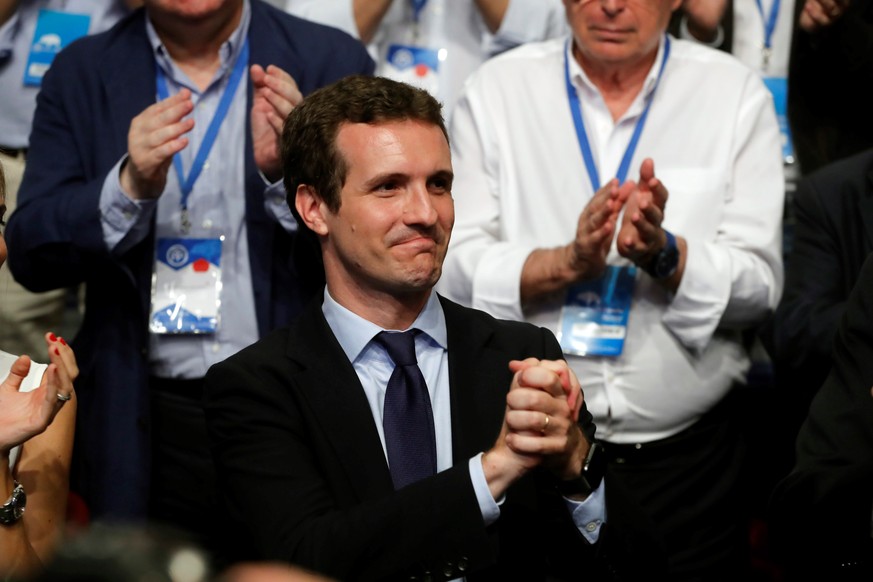 epa06902317 The newly-elected President of the Spanish conservative People&#039;s Party (PP), Pablo Casado (L), reacts during the People&#039;s Party (PP) national congress in Madrid, Spain, 21 July 2 ...