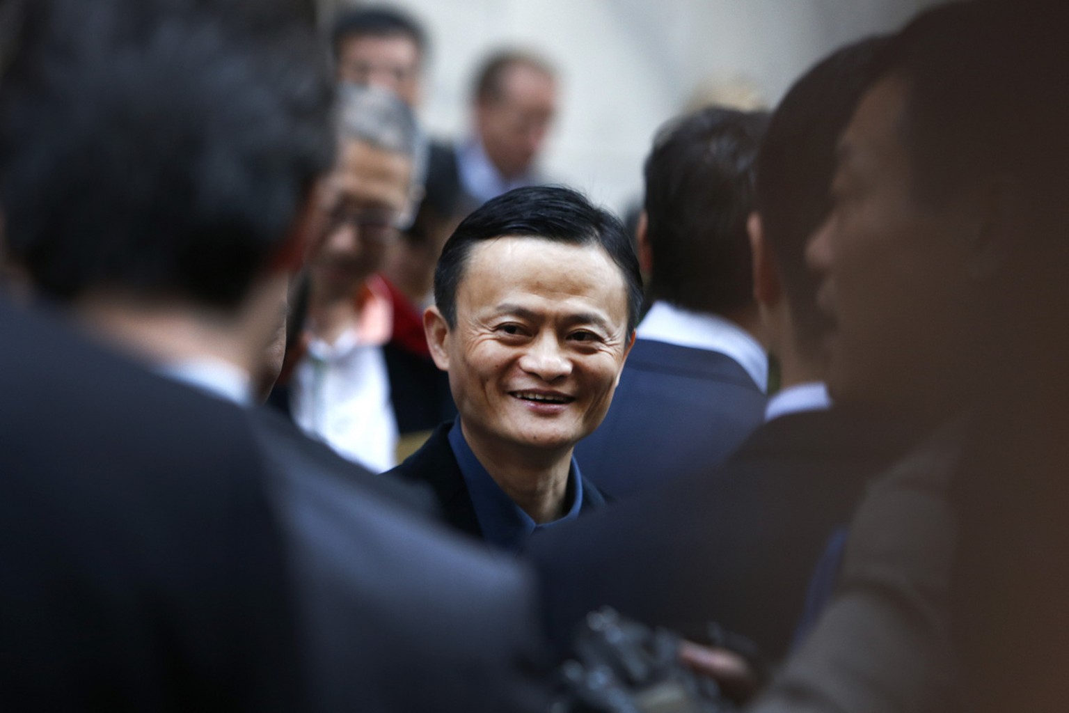 Alibaba founder Jack Ma mingles outside the New York Stock Exchange prior to his company&#039;s initial public offering, Friday, Sept. 19, 2014, in New York. The Chinese e-commerce giant goes public F ...