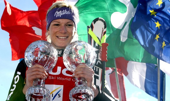 epa04133481 (FILE) A file picture dated 13 March 2008 shows Germany&#039;s Maria Riesch posing with her crystal globe trophies on the podium after winning the women&#039;s overall Super-G and the Supe ...