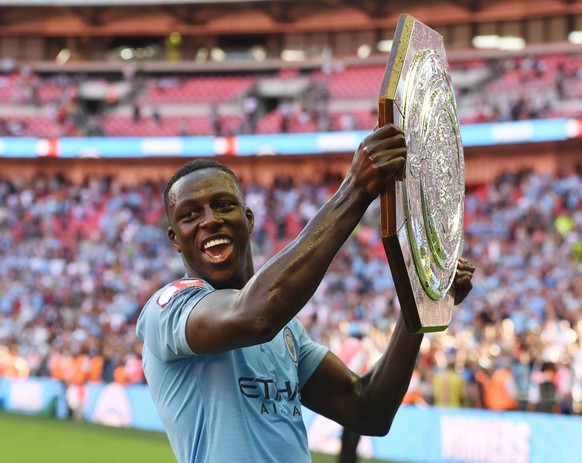 epa06929483 Manchester City&#039;s Benjamin Mendy celebrates with the trophy after winning their FA Community Shield match against Chelsea at Wembley Stadium in London, Britain, 05 August 2018. EPA/FA ...
