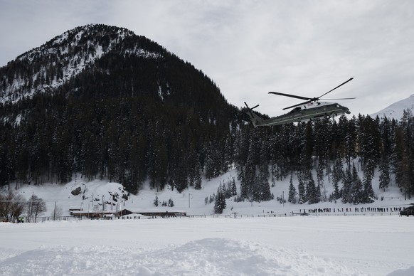 Marine One carrying US President Donald Trump arrives for the World Economic Forum, Thursday, Jan. 25, 2018, in Davos. (AP Photo/Evan Vucci)