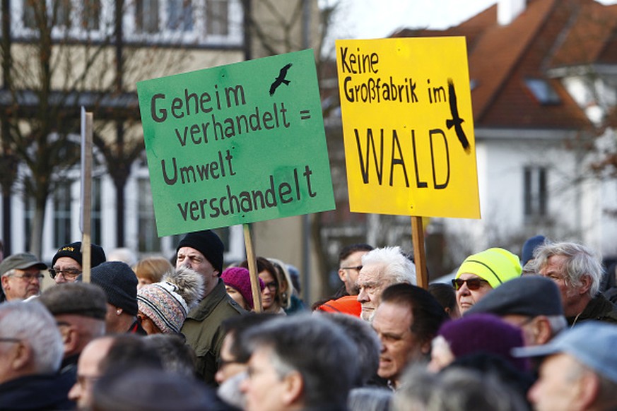 GRUENHEIDE, GERMANY - JANUARY 18: Protesters, demonstrate against the nearby planned new Tesla Gigafactory on the main square on January 18, 2020 in Gruenheide, Germany. They are criticising the felli ...