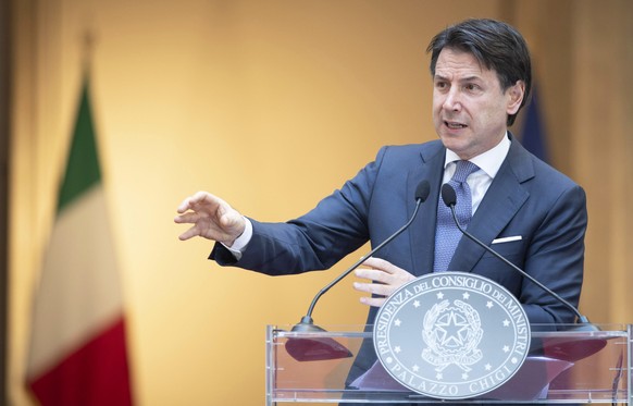epa08463321 A handout photo made available by Chigi Palace shows Italian Prime Minister, Giuseppe Conte, attends a press conference on the day of the reopening of borders between the Regions amid an e ...