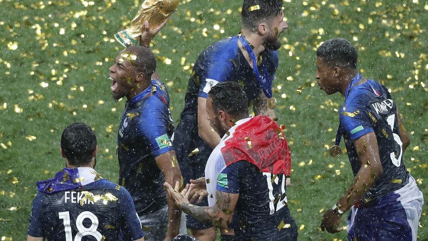 France&#039;s Djibril Sidibe hold the trophy after the final match between France and Croatia at the 2018 soccer World Cup in the Luzhniki Stadium in Moscow, Russia, Sunday, July 15, 2018. (AP Photo/F ...