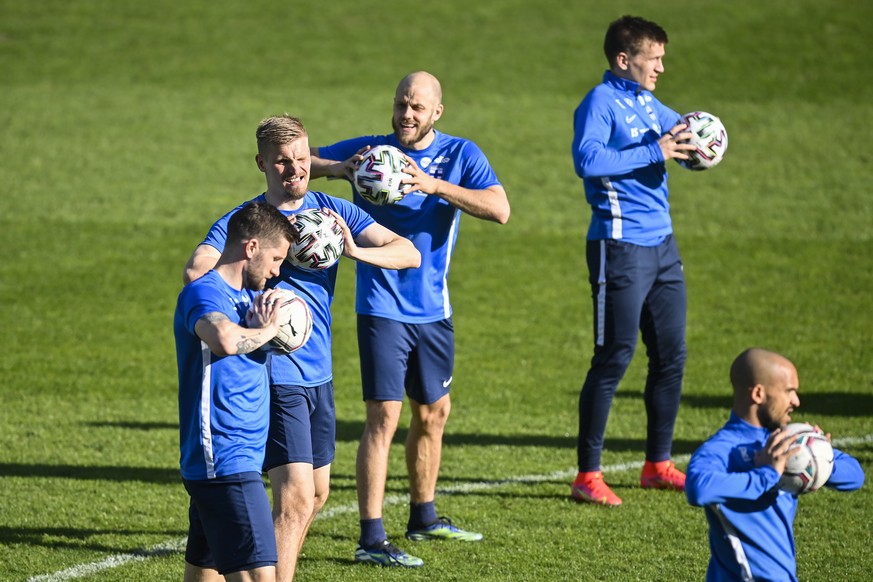 epa09106988 Finland&#039;s Juhani Ojala (2-L) during a training session at the Kybunpark stadium in St. Gallen, Switzerland, 30 March 2021. Finland will face Switzerland in their International friendl ...