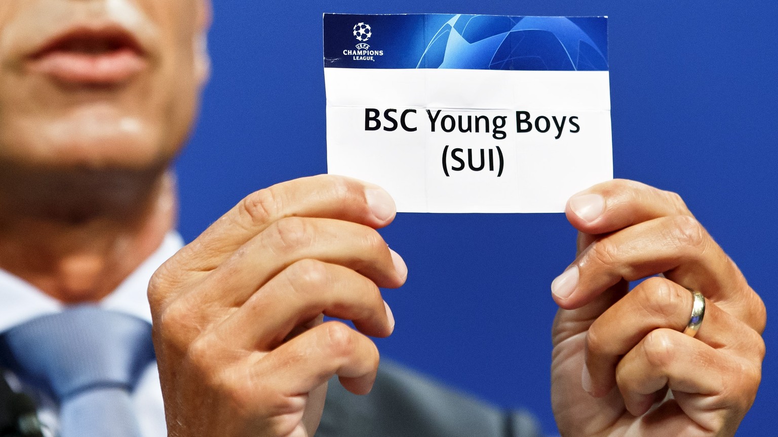 epa06930442 Michael Heselschwerdt, UEFA Head of Club Competition, shows a ticket of Swiss club BCS Young Boys, during the drawing for the 2018-2019 UEFA Champions League playoff round soccer matches a ...