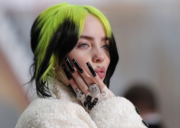 FILE - Billie Eilish arrives at the Oscars on Sunday, Feb. 9, 2020, at the Dolby Theatre in Los Angeles. The Grammy-winning star is releasing a collection of hundreds of rarely seen photos in May. Gra ...