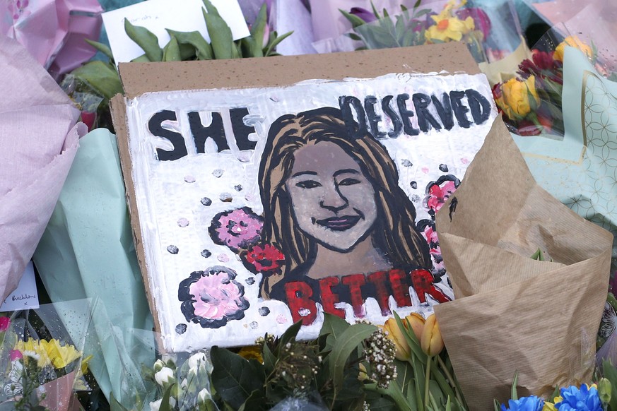 A drawing of Sarah Everard is placed with floral tributes and candles at the bandstand on Clapham Common, London, Sunday March 14, 2021, the day after hundreds of people disregarded a judge&#039;s rul ...