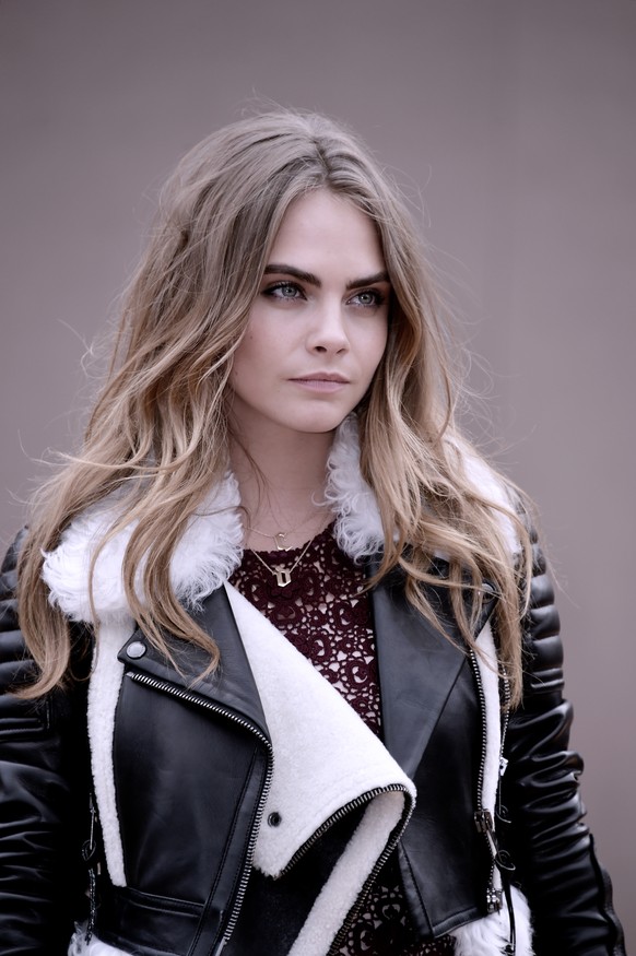 LONDON, ENGLAND - FEBRUARY 23: (Editors Note: Image has been digitally altered) Cara Delevingne attends the Burberry Prorsum show during London Fashion Week Fall/Winter 2015/16 at Perk&#039;s Field on ...