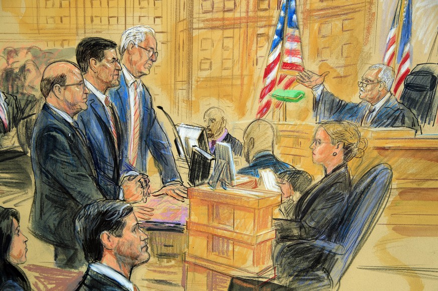 This courtroom sketch depicts former President Donald Trump&#039;s former national security adviser Michael Flynn, standing center, flanked by his lawyers, listening to U.S. District Judge Emmet Sulli ...