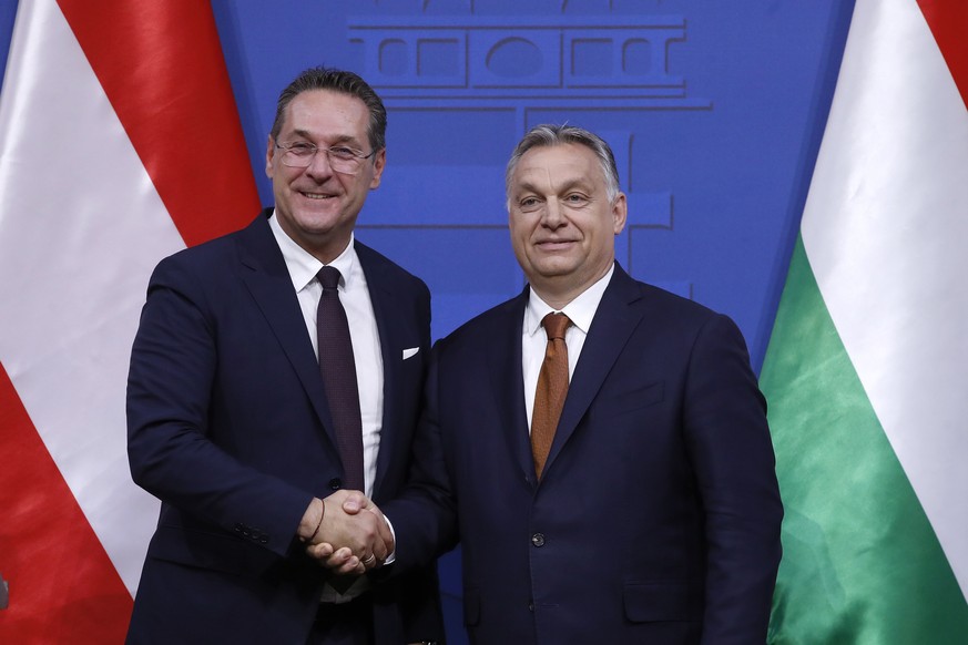 epa07551263 Hungarian Prime Minister Viktor Orban (R) and Austrian Vice Chancellor Heinz Christian Strache shake hands after holding a joint press conference at the PM’s office in the Castle of Buda i ...