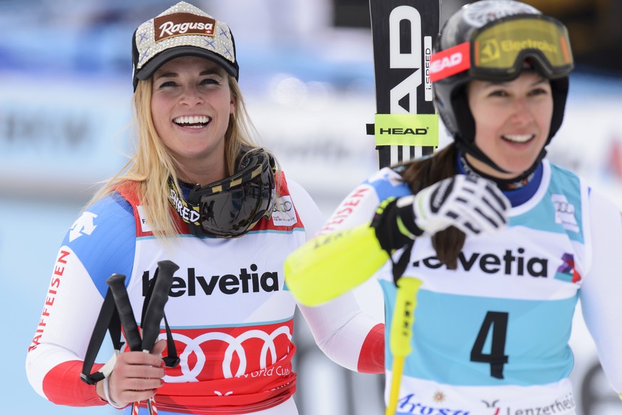 Lara Gut of Switzerland, left, reacts next to Wendy Holdener of Switzerland, right, in the finish area during the Super-G run of the women&#039;s Super Combined race at the FIS Alpine Ski World Cup in ...