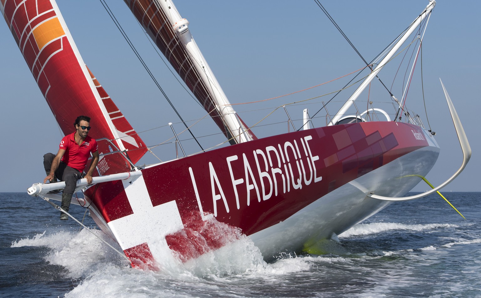 The 60-foot monohull IMOCA &quot;La Fabrique&quot; SUI7 sails with Swiss skipper Alan Roura onboard during a training session two months before the start of the Route du Rhum sailing race, at the west ...