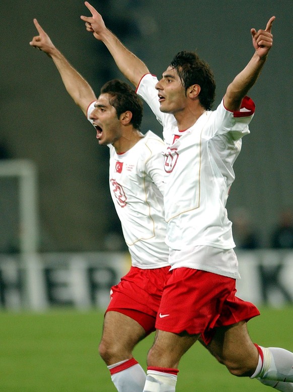 Turkey&#039;s Halil Altintop, right, celebrates with his brother Hamit Altintop after he scored his team&#039;s first goal against Germany at the Ataturk Olympic Stadium in Istanbul, Turkey, Saturday, ...