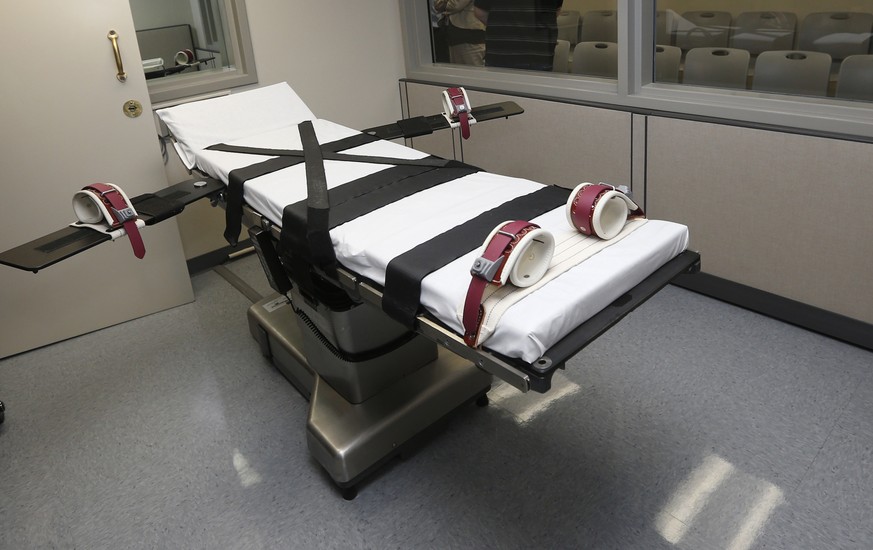 FILE - This Oct. 9, 2014, file photo shows the gurney in the the execution chamber at the Oklahoma State Penitentiary in McAlester, Okla. A group of doctors are asking corrections departments in state ...
