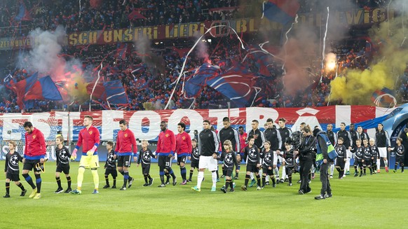 The teams enter the pitch prior to an UEFA Champions League Group stage Group A matchday 4 soccer match between Switzerland&#039;s FC Basel 1893 and France&#039;s Paris Saint-Germain Football Club, at ...