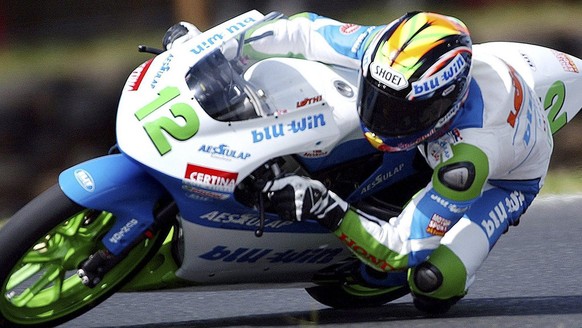 Swiss rider Thomas Luethi powers around the Phillip Island circuit during qualiying for the 125cc Australian Motorcycle Grand Prix in Melbourne, Saturday 16 October 2004. Luethi qualified eighth faste ...