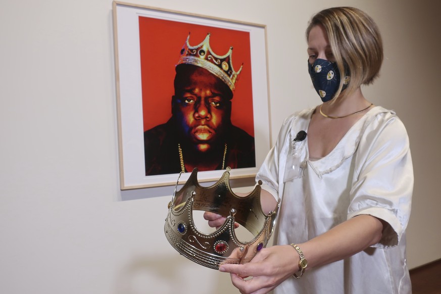 Sotheby&#039;s specialist Cassandra Hatton holds the plastic crown worn and signed by the Notorious B.I.G., Monday, Sept. 14, 2020, in New York. The auction house projects the crown will sell for betw ...