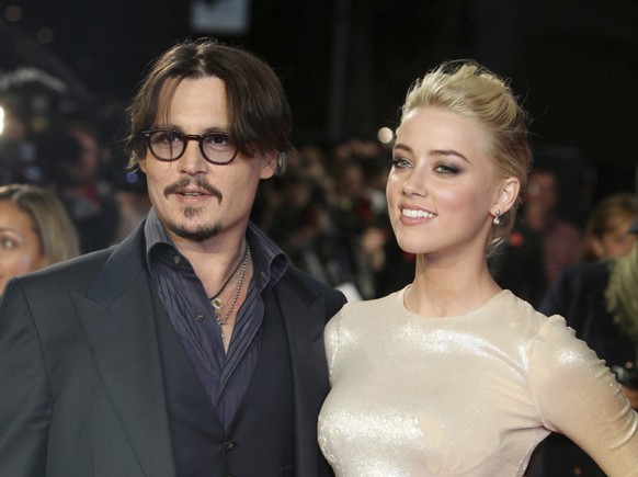 ARCHIV - US-Schauspieler Johnny Depp und Amber Heard kommen zur Europapremiere des Films