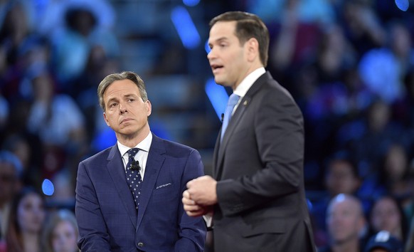 CNN&#039;s Jake Tapper listens to Republican Sen. Marco Rubio during a CNN town hall meeting, Wednesday, Feb. 21, 2018, in Sunrise, Fla. Rubio is being challenged by angry students, teachers and paren ...