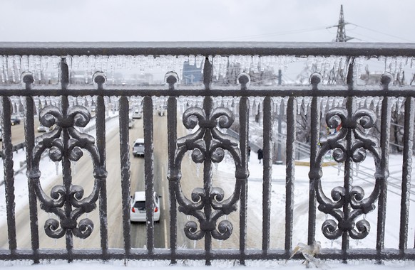 A railing covered in ice after an ice storm, on a street in Vladivostok, Russia, Friday, Nov. 20, 2020. Thousands of people in Russia&#039;s Far East region of Primorye remained without heating or ele ...