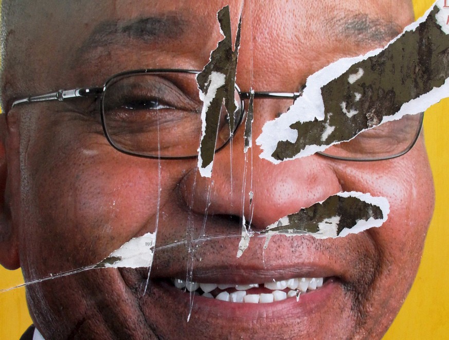 epa06514704 (FILE) - A torn African National Congress (ANC) election poster shows the face of ANC president Jacob Zuma, revealing that not all South African&#039;s want the ANC to remain in power, Sow ...