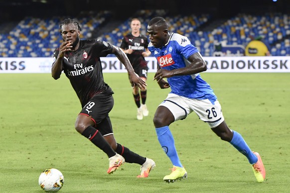 epa08542608 Milan&#039;s midfielder Franck Kessie&#039; (L) and Napoli&#039;s defender Kalidou Koulibaly in actionduring the Italian Serie A soccer match SSC Napoli vs AC Milan at the San Paolo stadiu ...