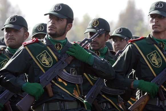 In this Sept. 21, 2008 file photo, Iranian Revolutionary Guard members march during a parade ceremony, marking the 28th anniversary of the onset of the Iran-Iraq war (1980-1988), just outside Tehran,  ...