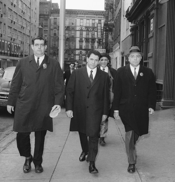 In this March 24, 1966, file photo, John &quot;Sonny&quot; Franzese, center, is escorted to the Elizabeth Street police station in New York, after his arrest on a 43-count gambling indictment. Franzes ...