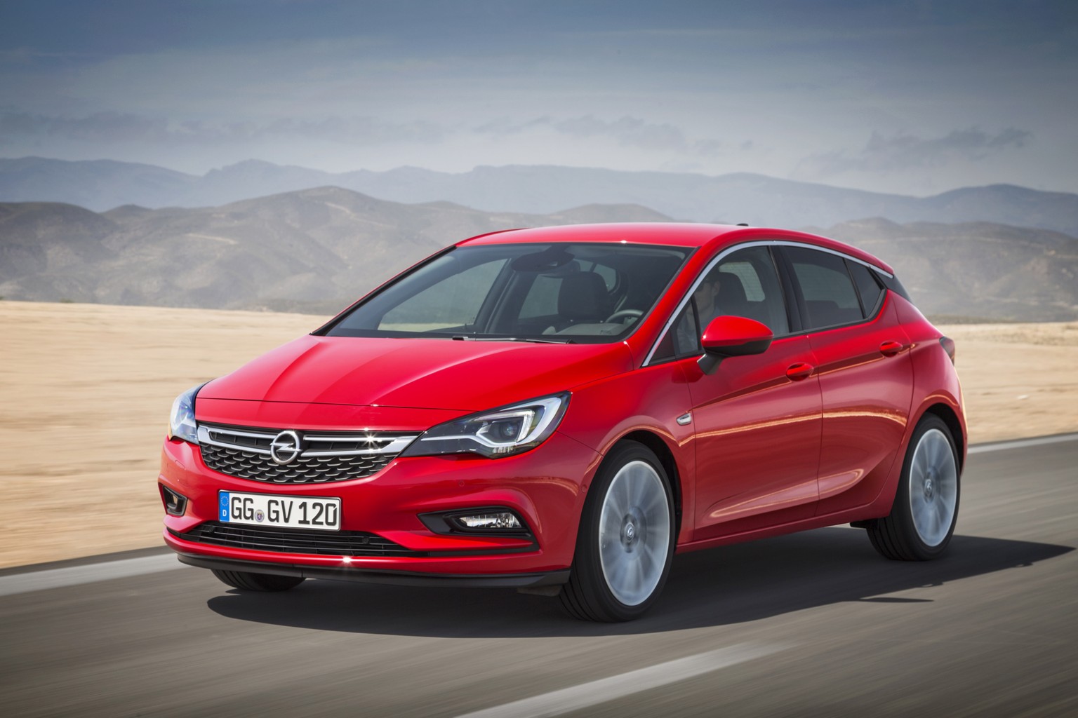 The photo released by General Motors shows the new Opel Astra. GMs redesigned Opel Astra will have its world premiere at the Frankfurt car show. (Opel/GM via AP)